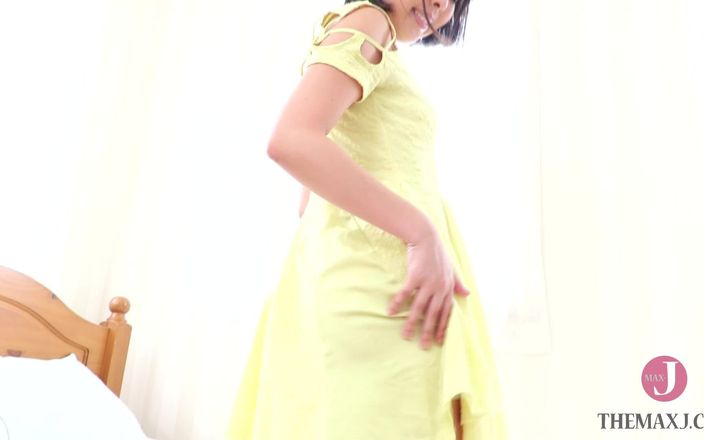 A Girl in a Yellow Dress Playing with Adult Toys.