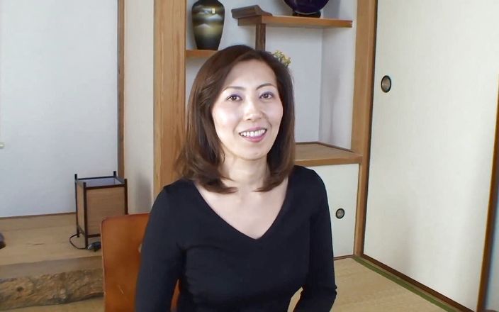 Brunette asian milf stripping and showing what she's got