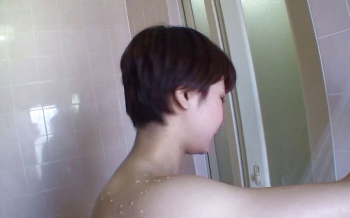 Hairy asian brunette is having a shower