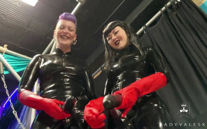 Latex Dommes invite you to suck their huge strap ons