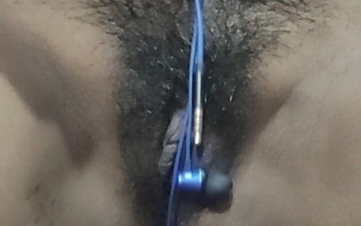 Sexy Desi Bhabhi Fingering Her Pussy with Earphones in the Bedroom